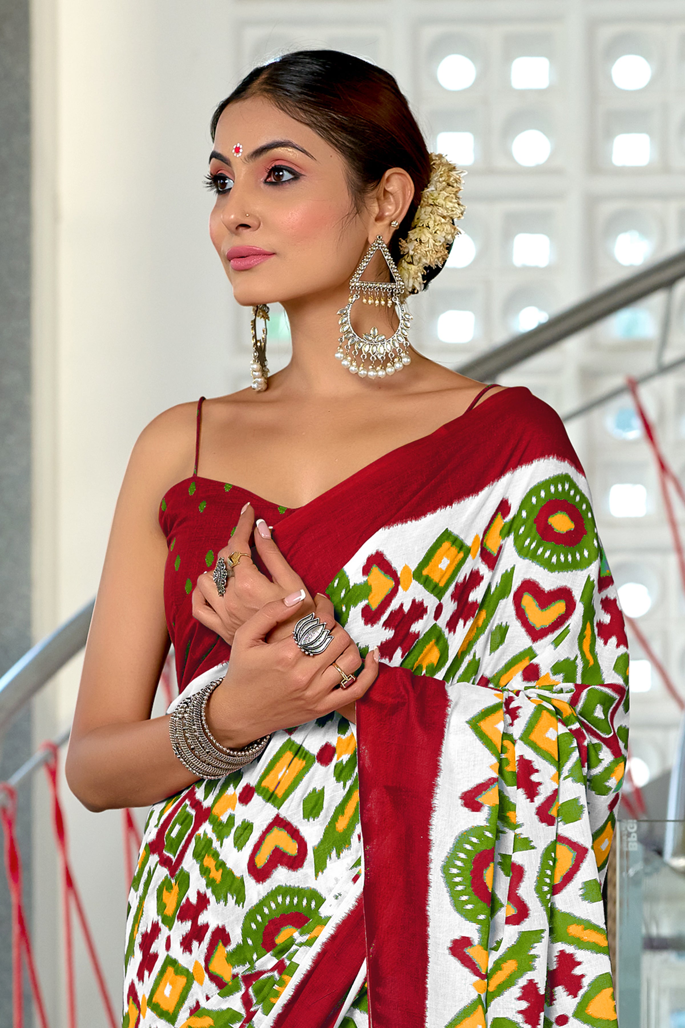 NAYANTHARA PURE MULMUL COTTON IKKAT PRINTD MARRON AND GREEN SAREE